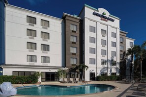 Outdoor pool, open 7:00 AM to 10 PM, pool umbrellas