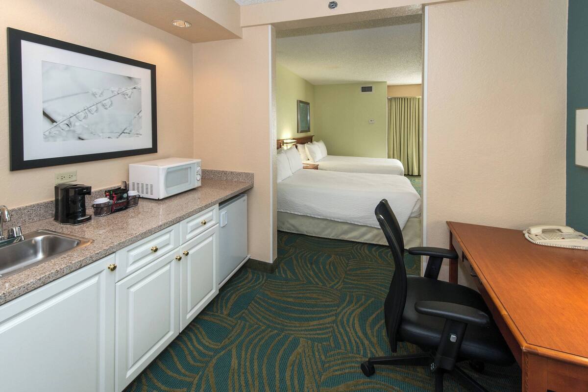 suite, multiple beds | living area | 32-inch flat-screen tv with cable channels, tv