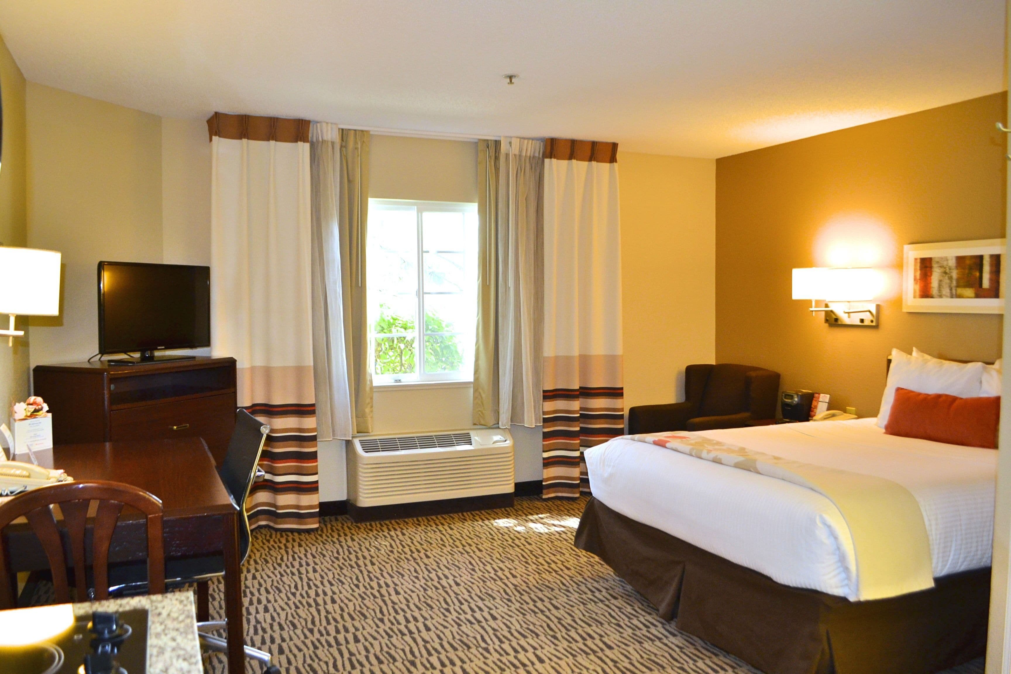 Premium bedding, pillow-top beds, desk, laptop workspace