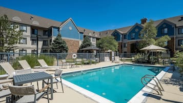 Seasonal outdoor pool, pool umbrellas, pool loungers