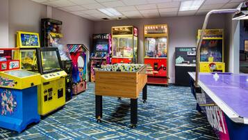 Enjoy games and entertainment in this lively area featuring a foosball table, pool table, and arcade games.