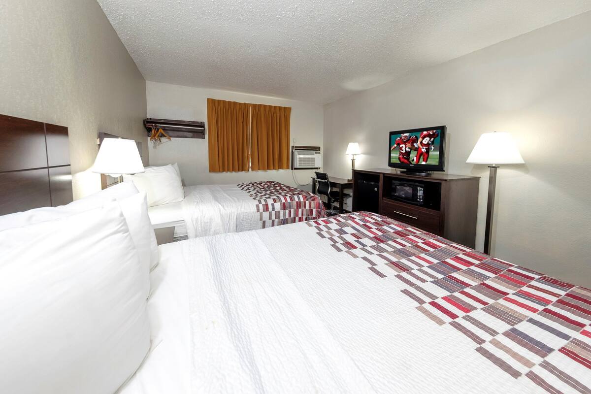 Desk, laptop workspace, cribs (free), WiFi (free)