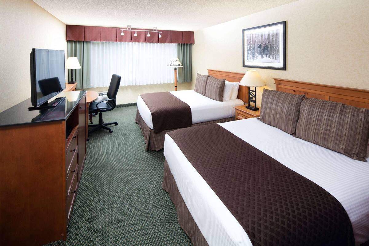 Premium bedding, pillowtop beds, desk, laptop workspace
