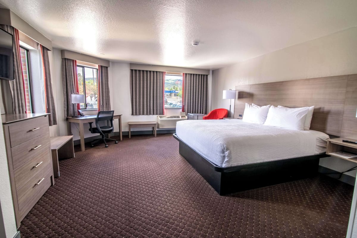 Family Suite, 1 King Bed, Non Smoking, Refrigerator & Microwave | 1 bedroom, desk, laptop workspace, blackout drapes