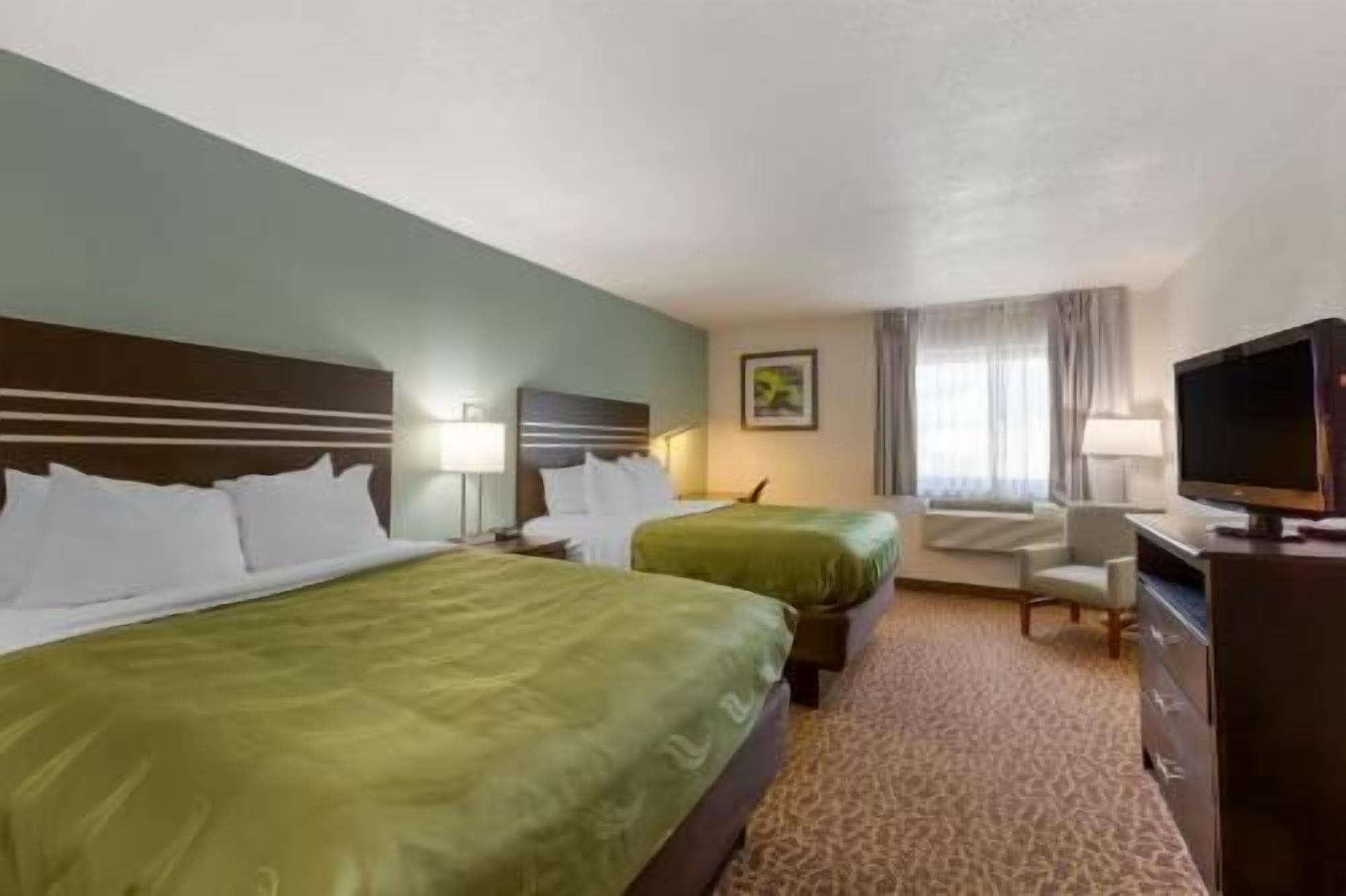 Premium bedding, pillowtop beds, desk, laptop workspace