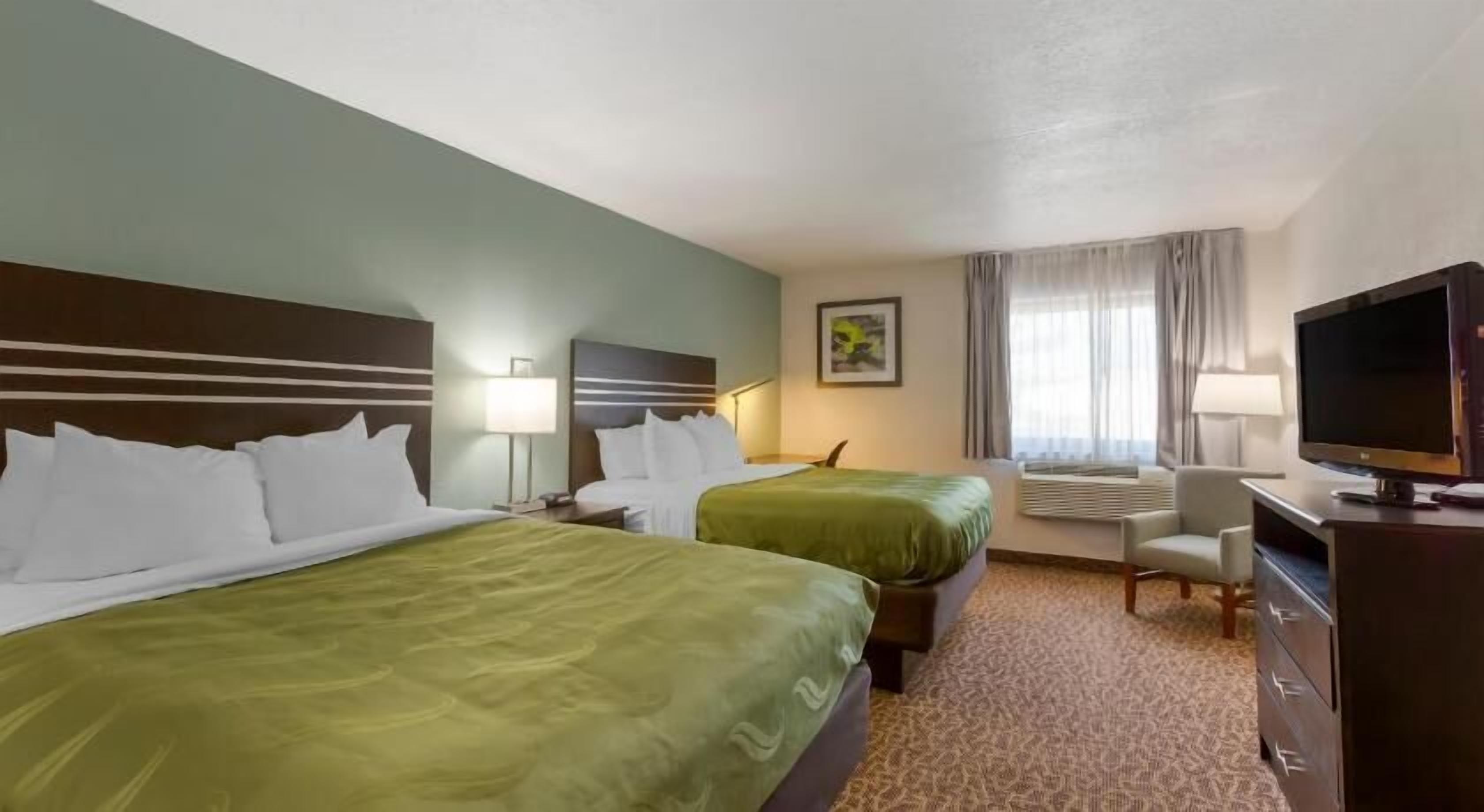 Premium bedding, pillowtop beds, desk, laptop workspace