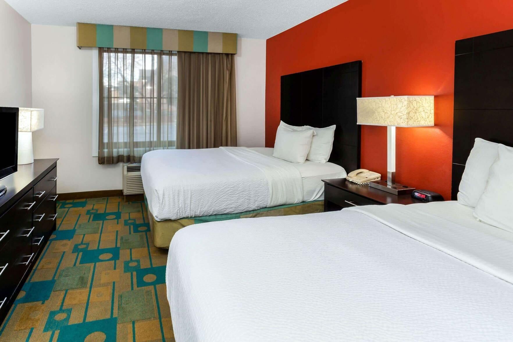 Premium bedding, pillowtop beds, desk, laptop workspace