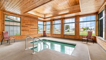 Indoor pool, open 9:00 AM to midnight, pool loungers