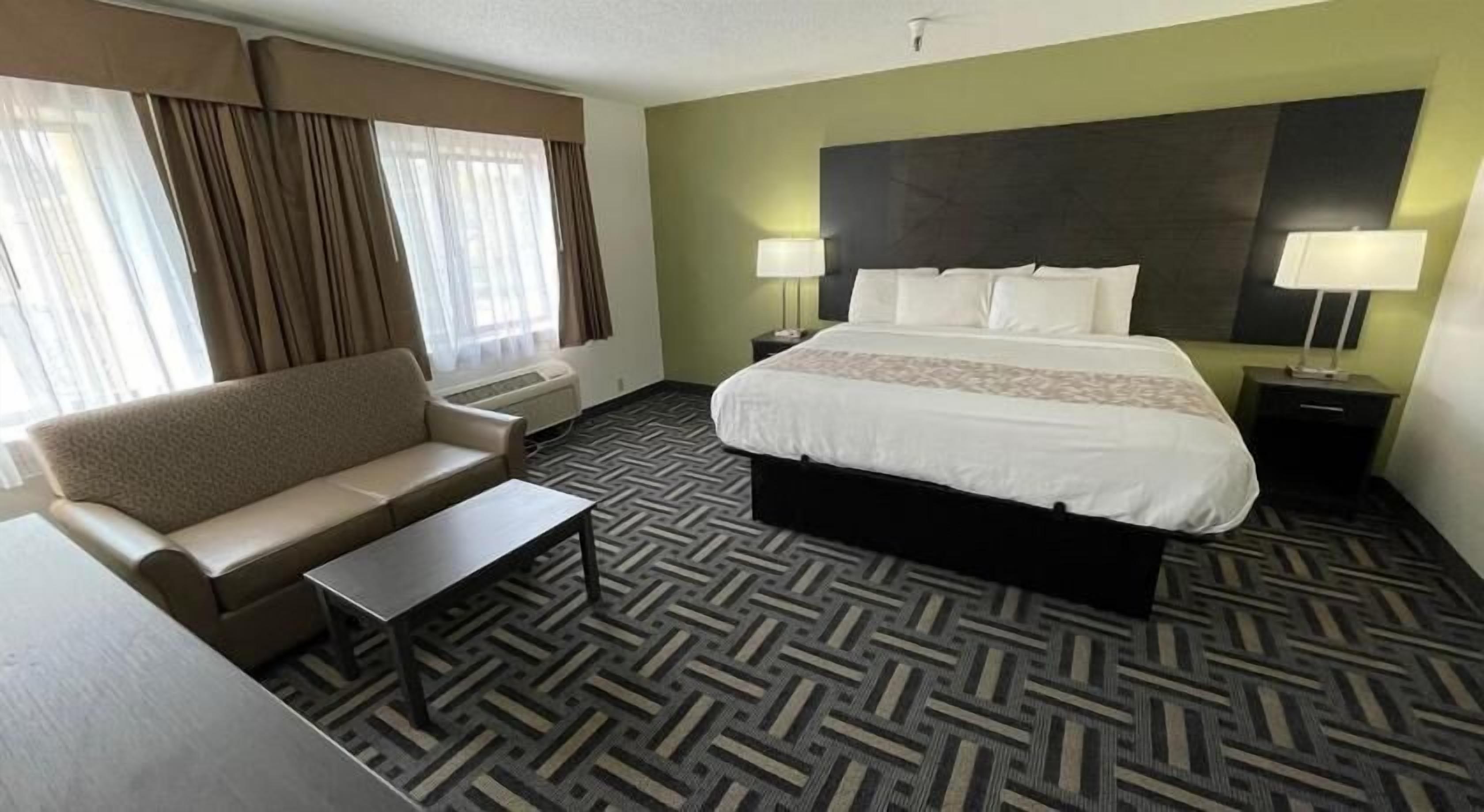 Premium bedding, desk, laptop workspace, blackout curtains