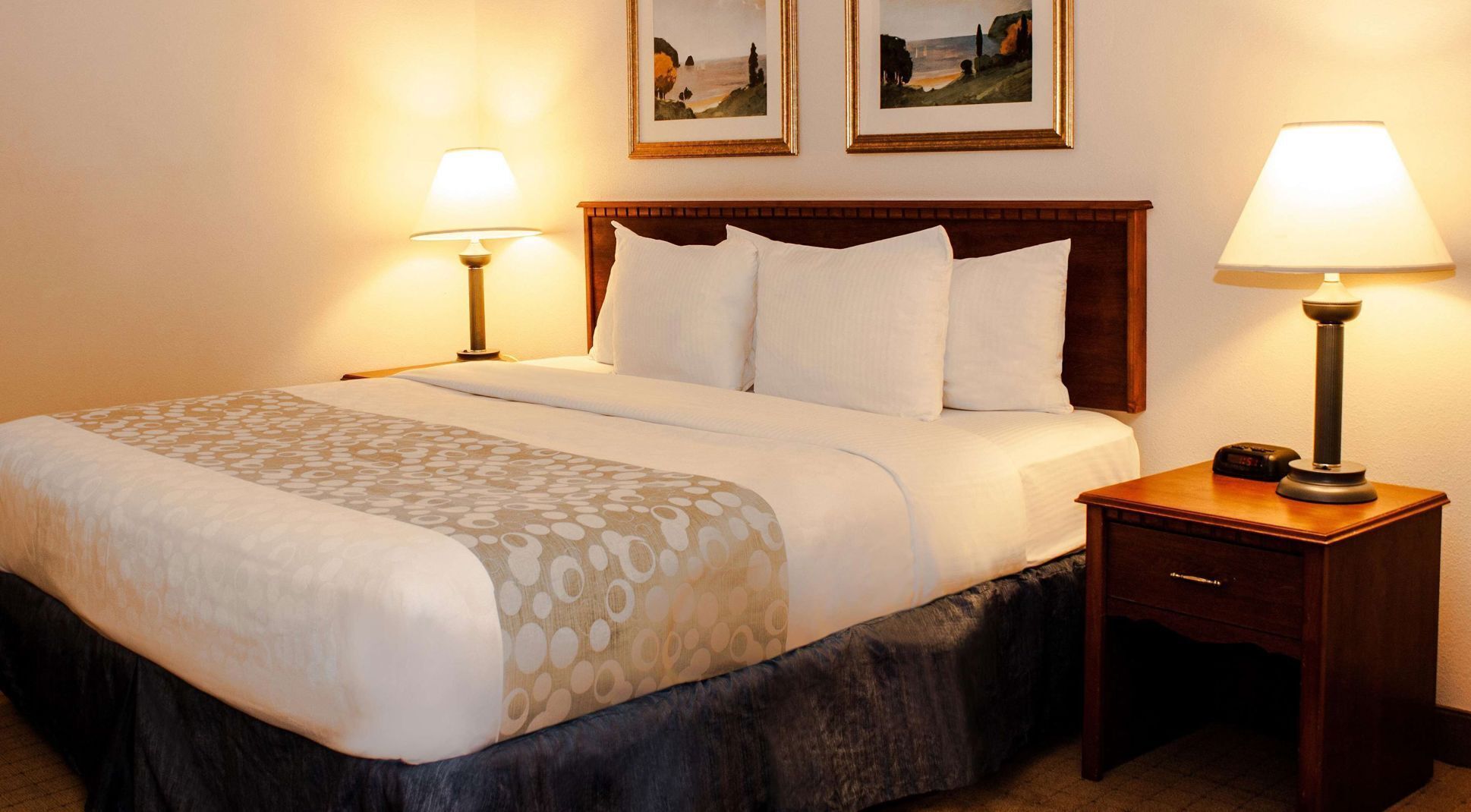 Premium bedding, desk, laptop workspace, blackout curtains