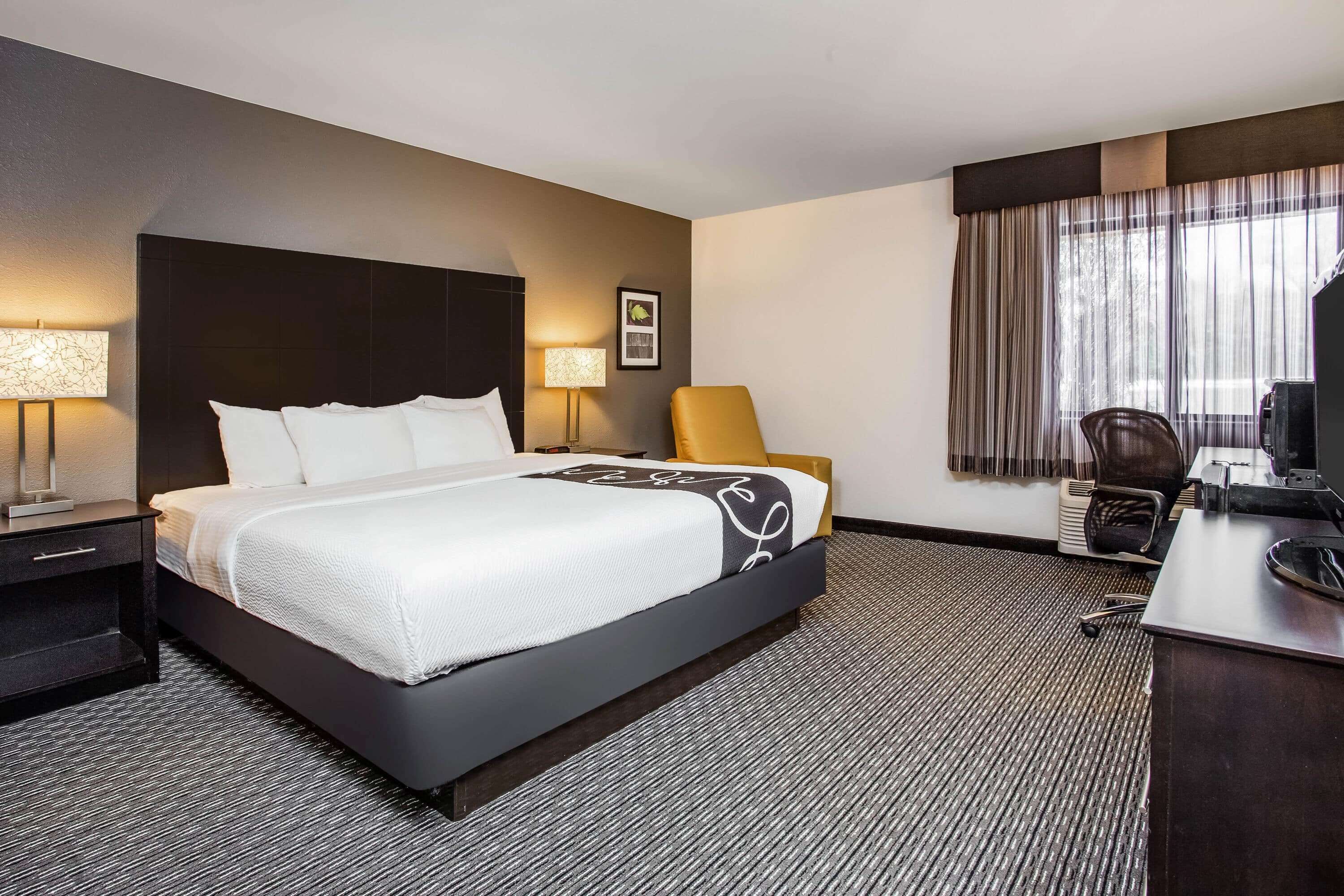 premium bedding, desk, blackout curtains, iron/ironing board