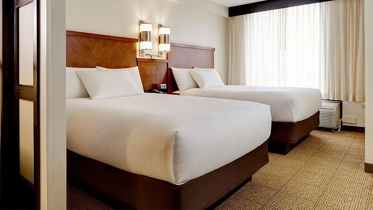 premium bedding, pillow-top beds, desk, blackout curtains