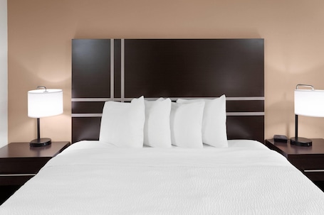 Hypo-allergenic bedding, desk, blackout drapes, soundproofing