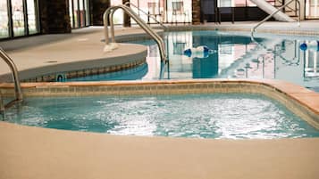 Indoor pool, open 7:00 AM to 11:00 PM, pool loungers