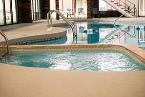 Indoor pool, open 7:00 AM to 11:00 PM, pool loungers