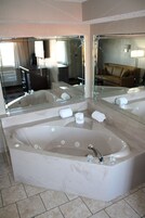 Suite, 1 King Bed, Non Smoking, Jetted Tub | Living area | 32-inch flat-screen TV with cable channels, TV