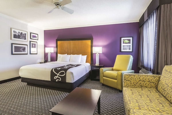 Premium bedding, desk, laptop workspace, blackout curtains