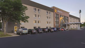 A La Quinta hotel with a parking lot and a covered entrance.