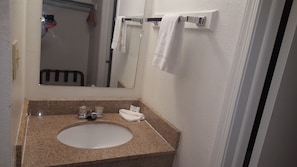 Basic Single Room, 1 King Bed | Bathroom | Combined shower/bathtub, free toiletries, towels