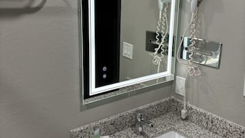 Bathtub, free toiletries, hair dryer, towels