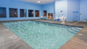 An indoor swimming pool with clear water, marked lanes, and a blue wall. - Super 8 by Wyndham Corvallis (Corvallis)