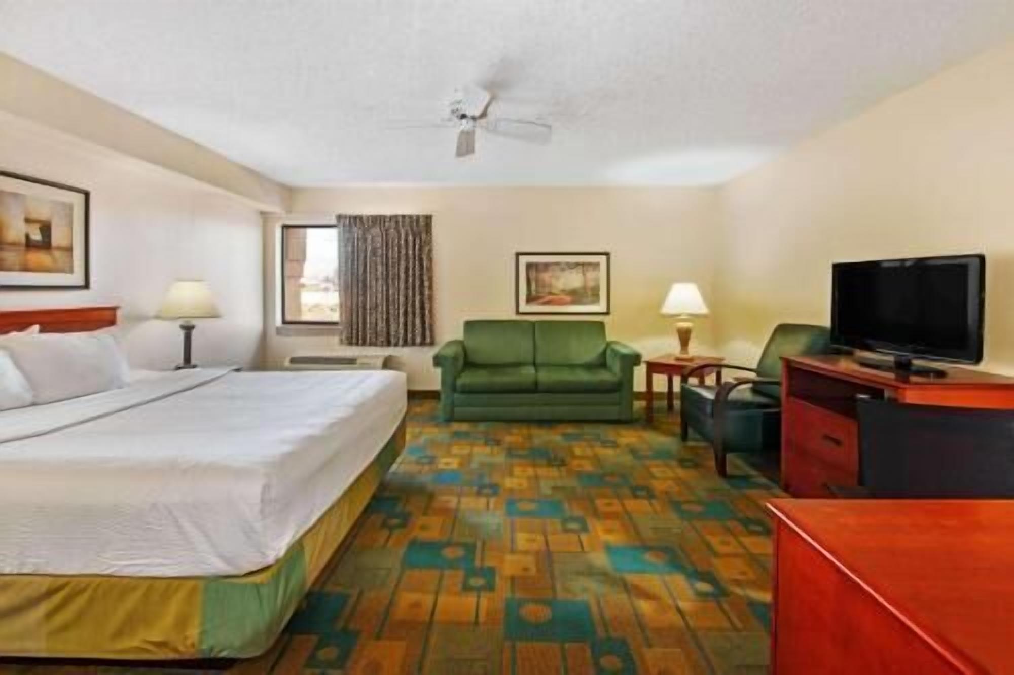 Premium bedding, desk, laptop workspace, iron/ironing board