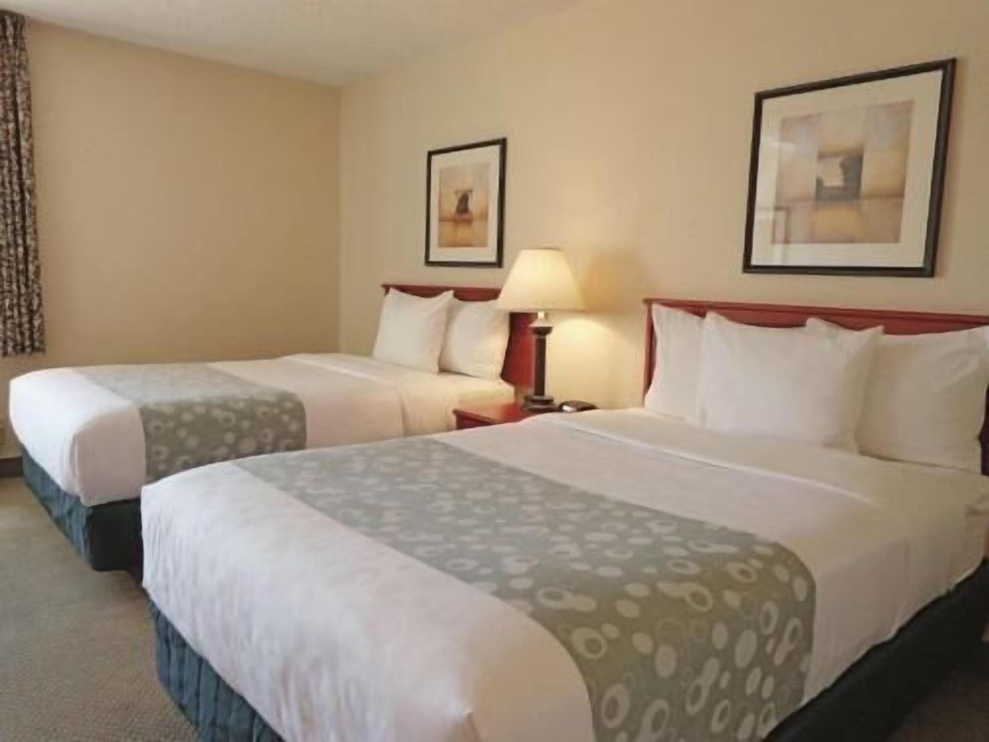 Premium bedding, desk, laptop workspace, iron/ironing board