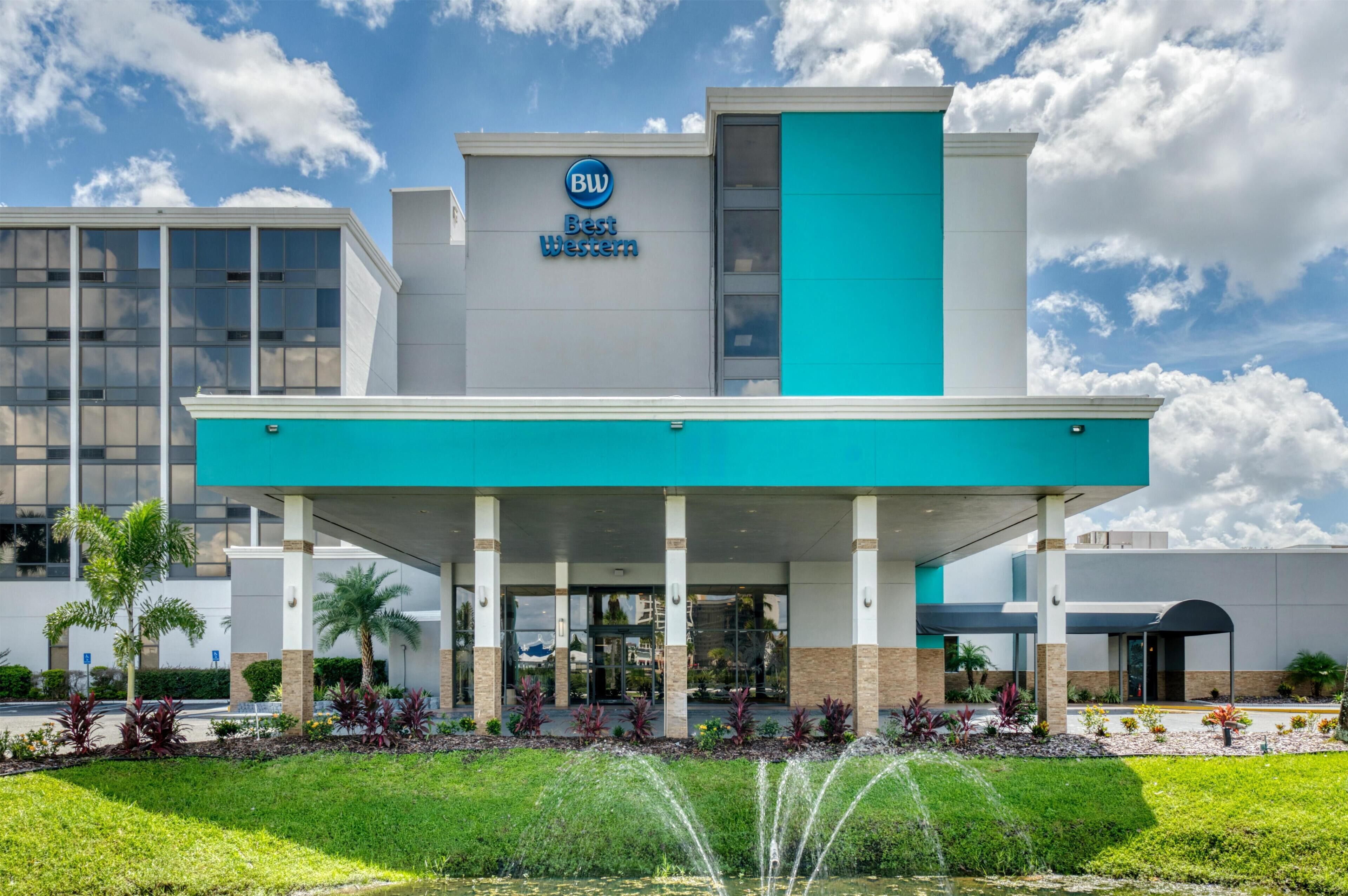 A Best Western hotel with a modern facade, large windows, and a covered entrance area.