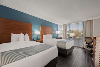 Standard Room, 2 Double Beds, Patio, Poolside | Premium bedding, in-room safe, desk, laptop workspace at Best Western Orlando Gateway Hotel