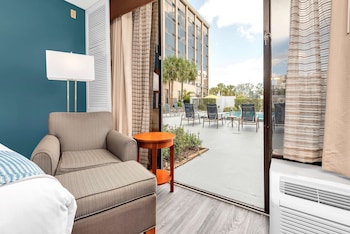 Standard Room, 2 Double Beds, Patio, Poolside | Premium bedding, in-room safe, desk, laptop workspace at Best Western Orlando Gateway Hotel