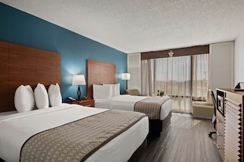 Hotel amenities such as safe, desk and work area at Best Western Orlando Gateway Hotel