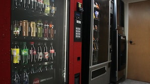 A vending machine with various beverages and a control panel. - Red Roof Inn PLUS+ Palm Coast (Palm Coast)