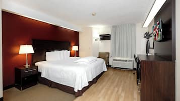 Desk, laptop workspace, blackout drapes, iron/ironing board