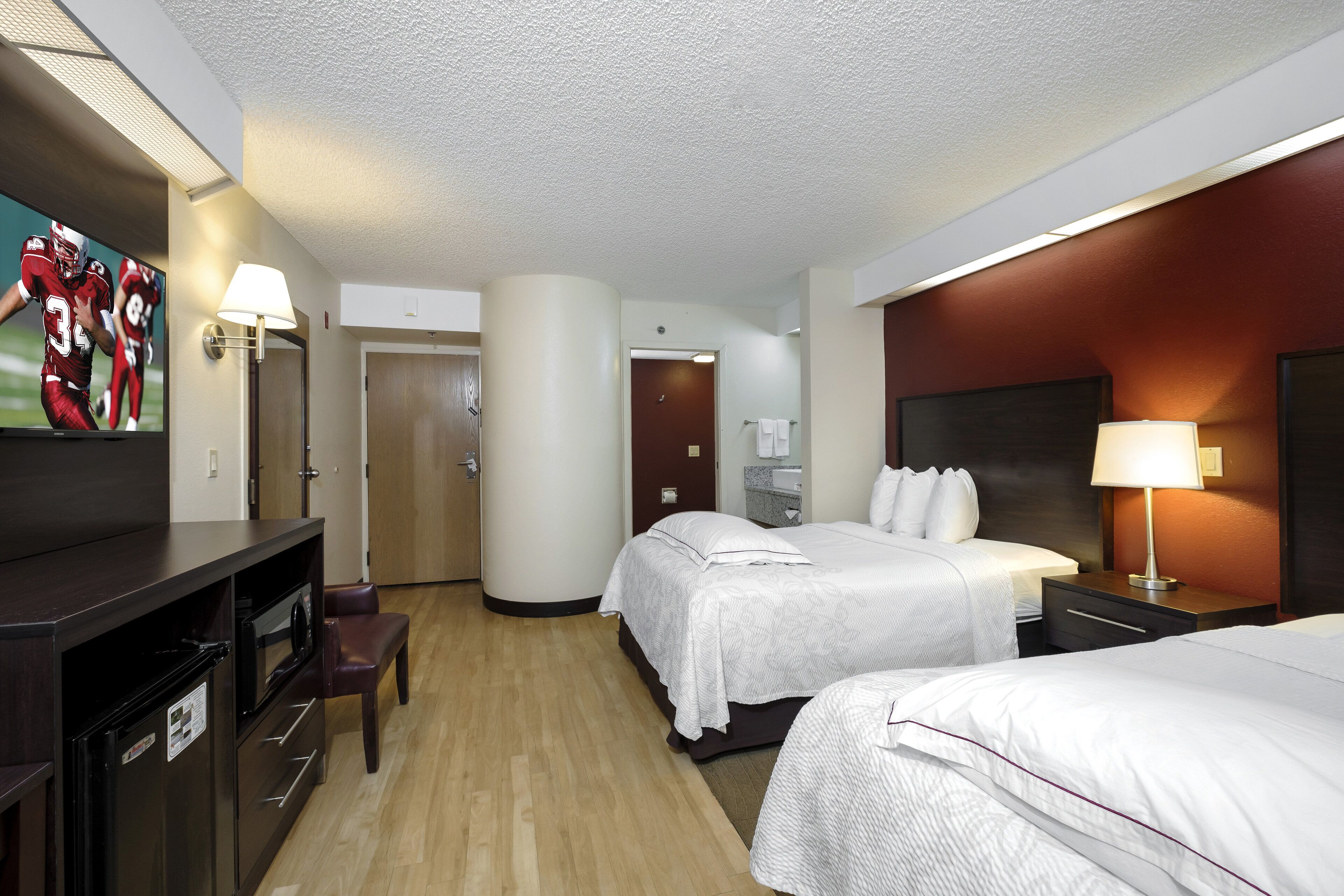 premium room, 2 double beds, poolside (upgraded bedding & snack, smoke free) | desk, laptop workspace, blackout curtains, iron/ironing board