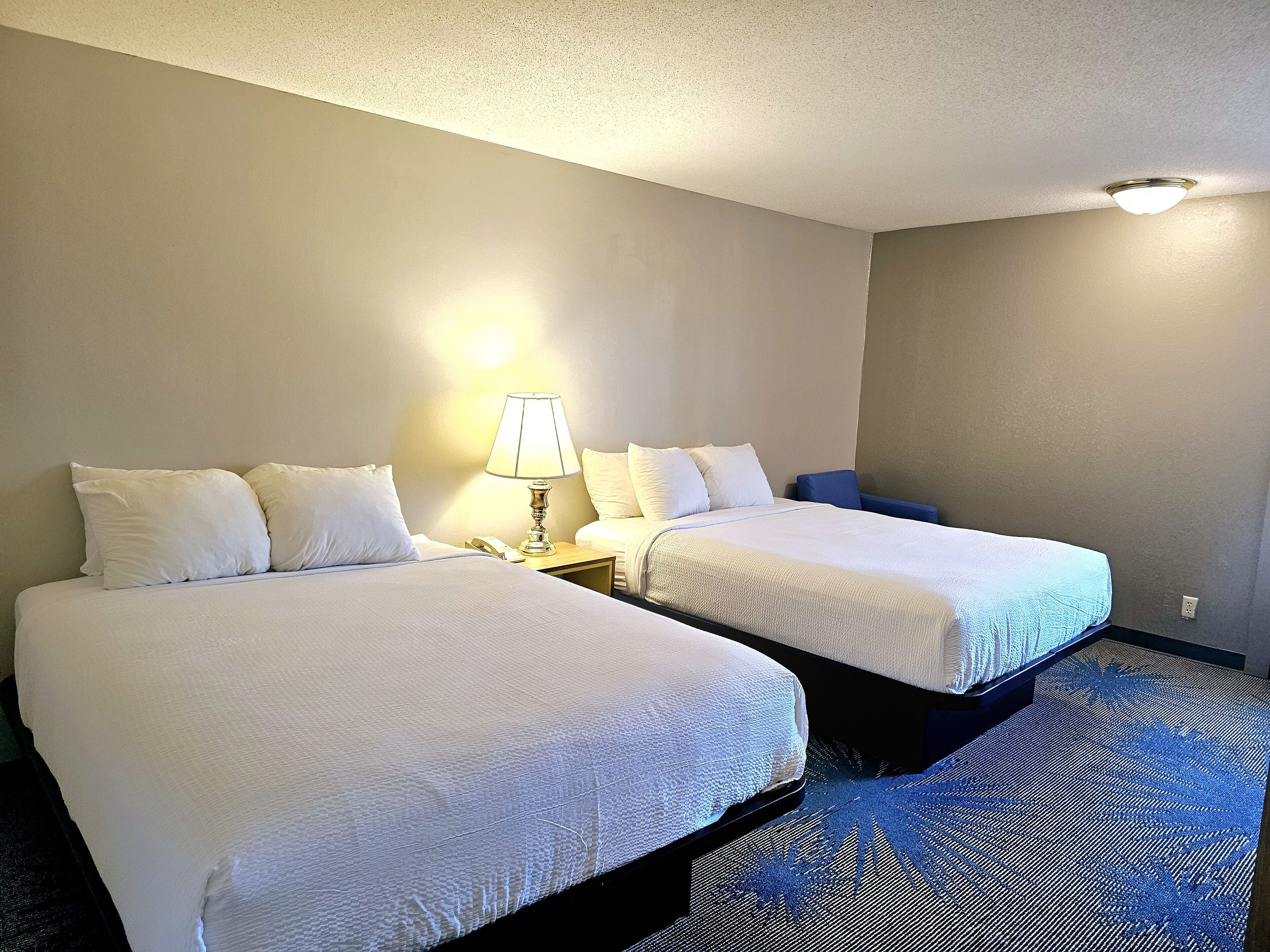 room, 2 queen beds, non smoking | 1 bedroom, desk, iron/ironing board, free cots/infant beds