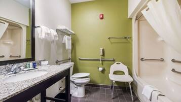 A bathroom with a sink, toilet, and shower.