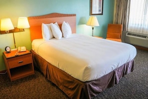 Desk, bed sheets, alarm clocks