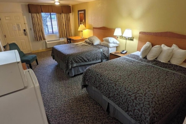 Desk, bed sheets, alarm clocks