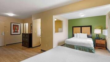 Premium bedding, desk, laptop workspace, iron/ironing board