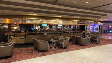 A bar area with seating and a counter.