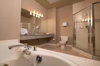 Combined shower/tub, designer toiletries, hair dryer, towels at Nugget Casino Resort