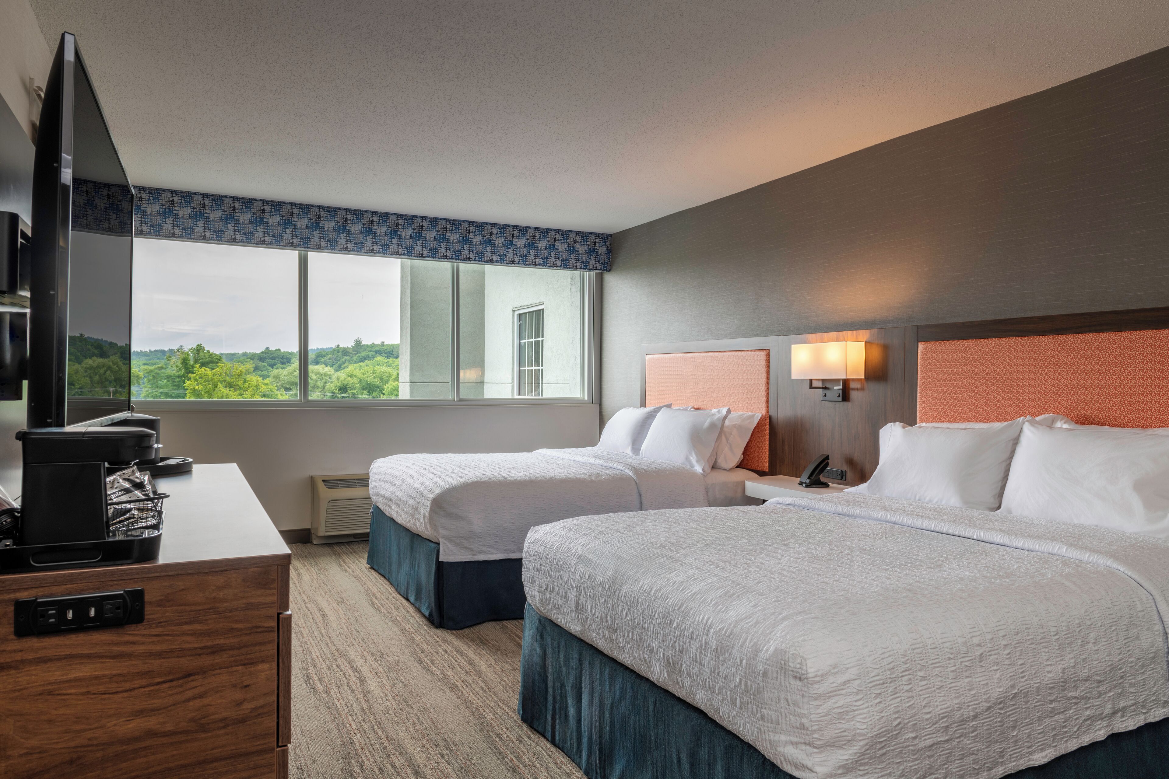 premium bedding, pillow-top beds, desk, laptop workspace