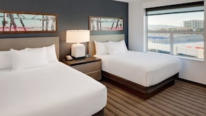A hotel room with two beds, a nightstand with a lamp, and artwork on the walls. - HYATT house Mt. Laurel (Mount Laurel)