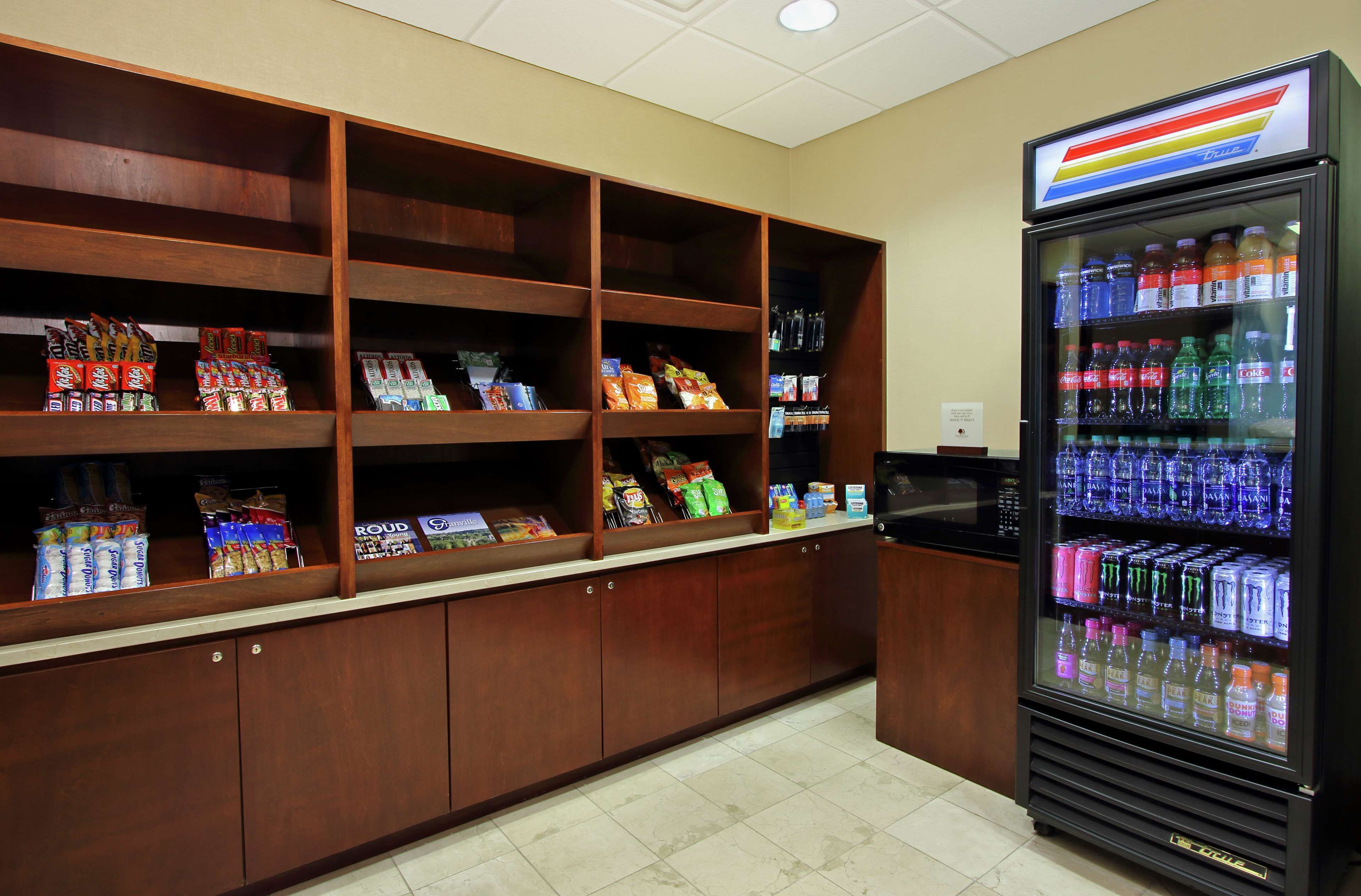 A vending area with snack and drink options, including a refrigerated drink cooler.