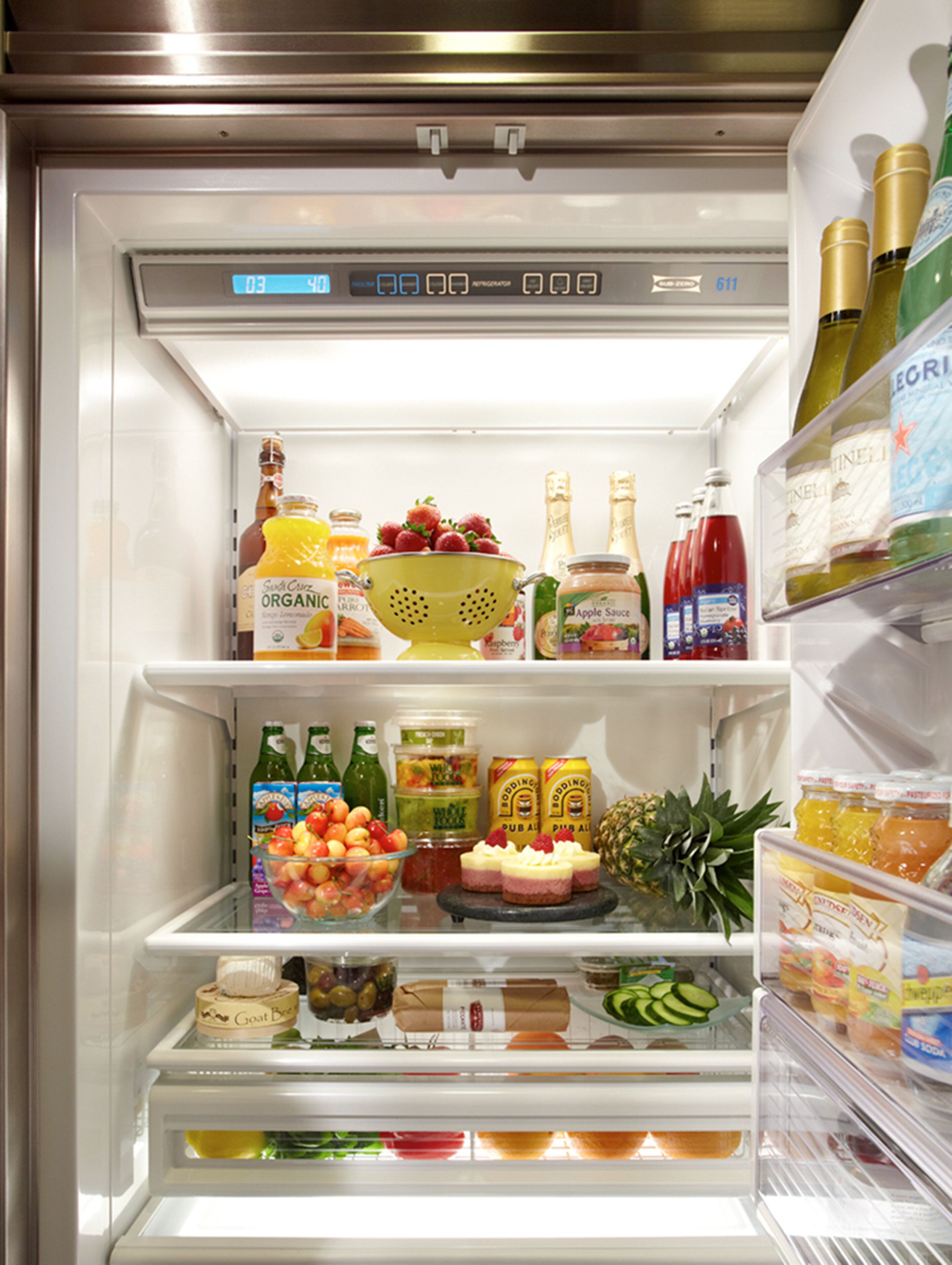 A well-organized refrigerator stocked with various food items and beverages.