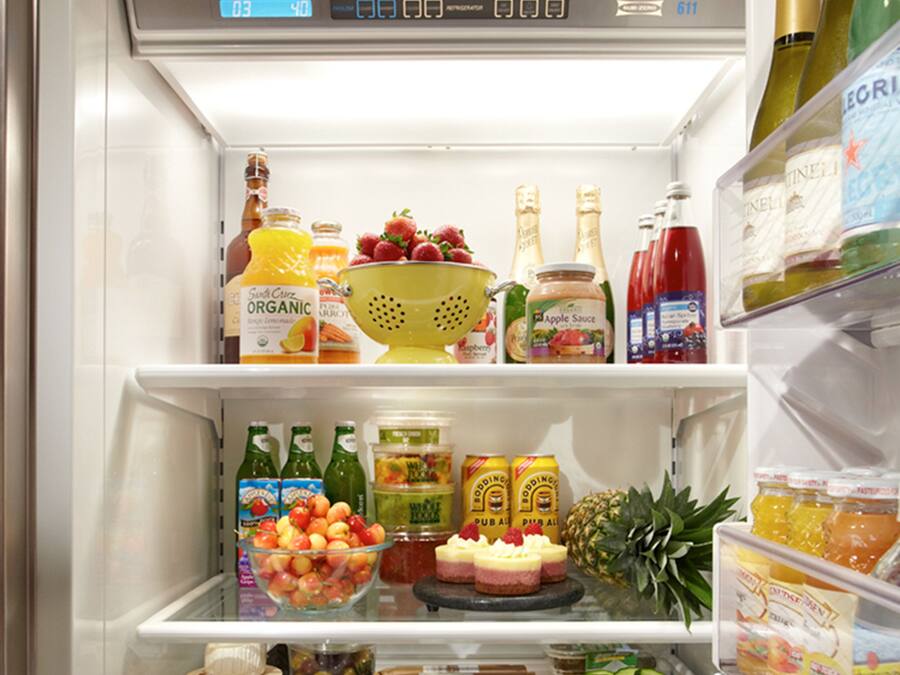 A well-organized refrigerator stocked with various food items and beverages.
