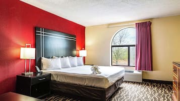 Suite, 1 King Bed, Non Smoking | Desk, laptop workspace, blackout drapes, iron/ironing board