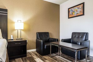 Desk, laptop workspace, blackout drapes, iron/ironing board