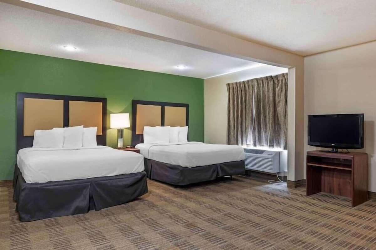 Premium bedding, desk, laptop workspace, free WiFi