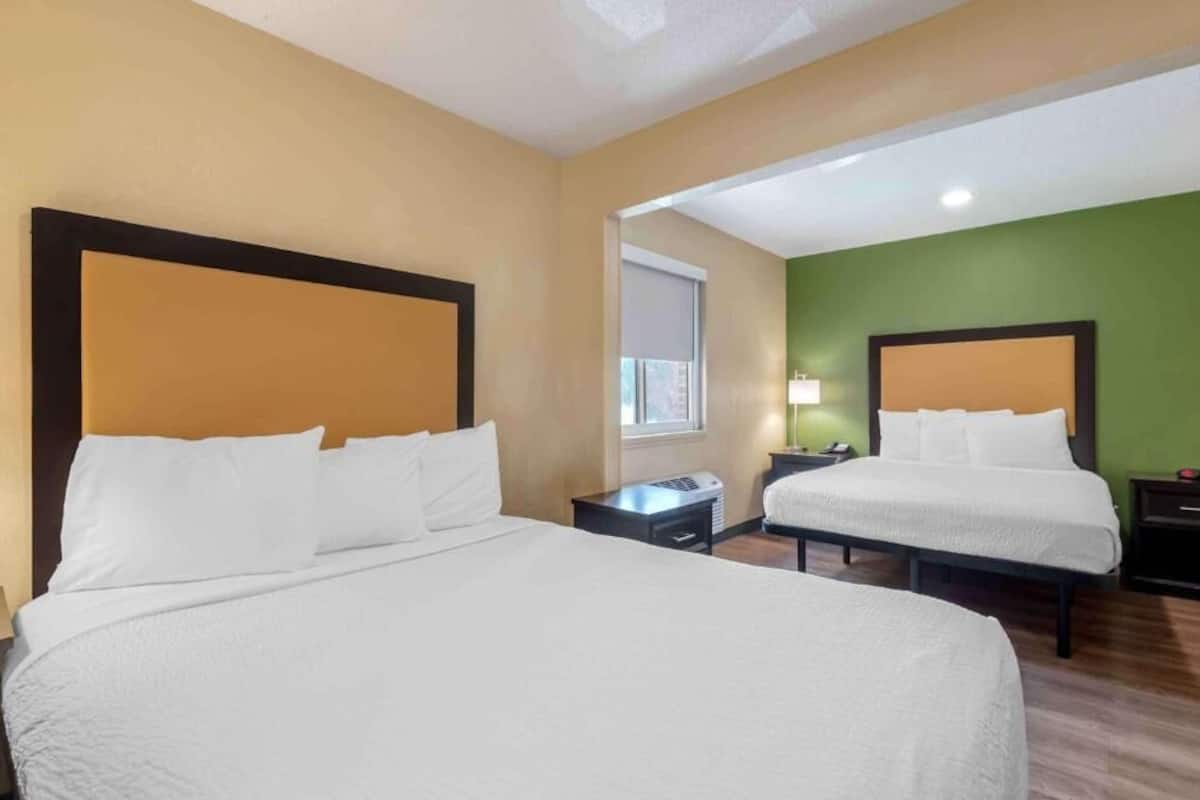 Premium bedding, desk, laptop workspace, free WiFi